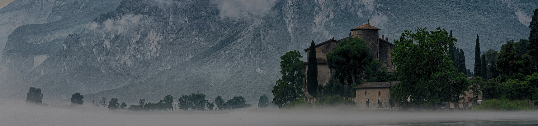 Panoramic view of an Italian villa surrounded by mountains, reflecting the lifestyle and landscape connected to Italy’s Golden Visa program.